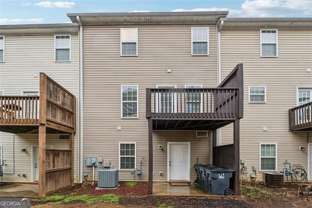 back of property featuring central AC unit