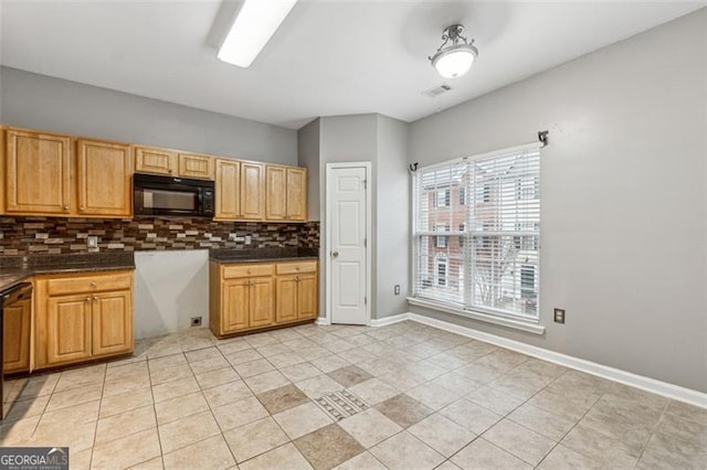 kitchen featuring visible vents, decorative backsplash, dark countertops, black appliances, and light tile patterned flooring