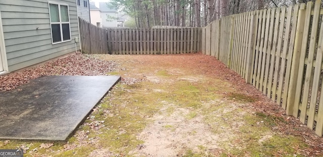 view of yard with a fenced backyard