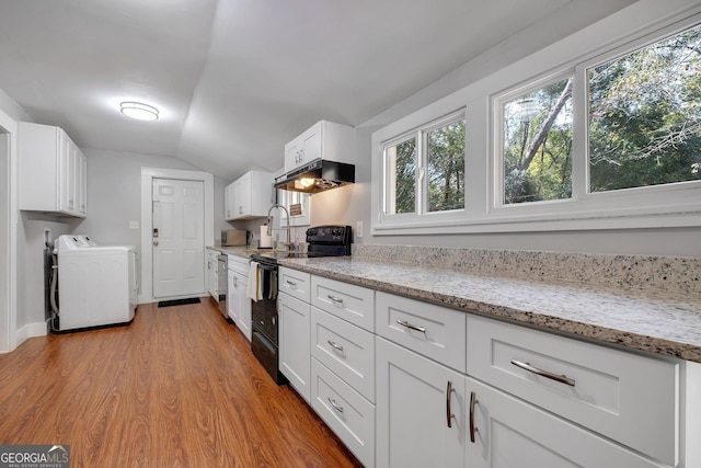 kitchen featuring light stone counters, black electric range oven, light wood-style floors, white cabinetry, and under cabinet range hood