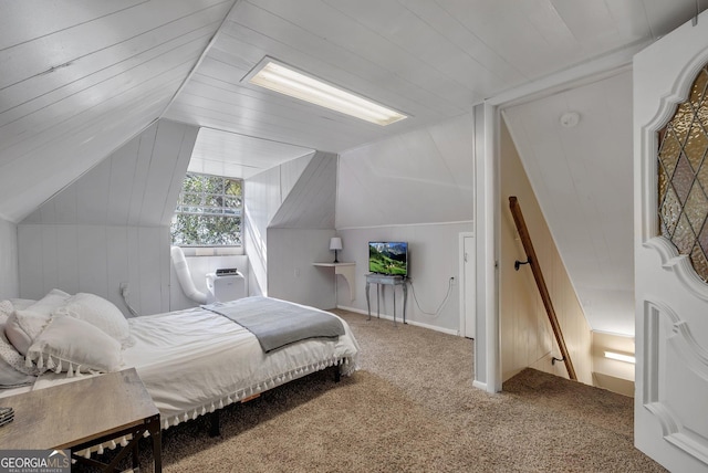 bedroom with vaulted ceiling and carpet floors