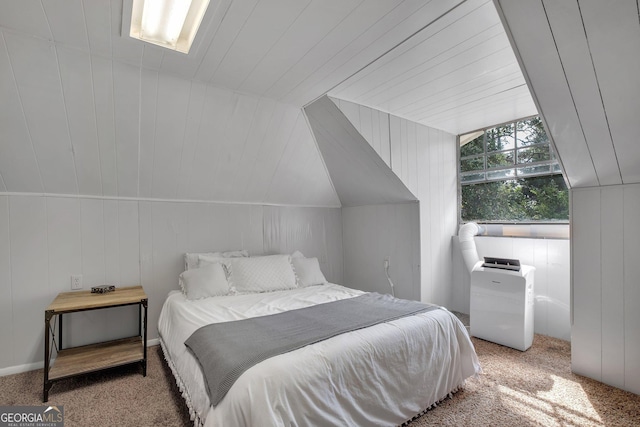 bedroom featuring vaulted ceiling and light colored carpet