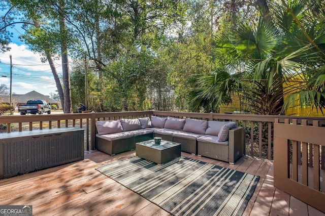 deck featuring outdoor lounge area