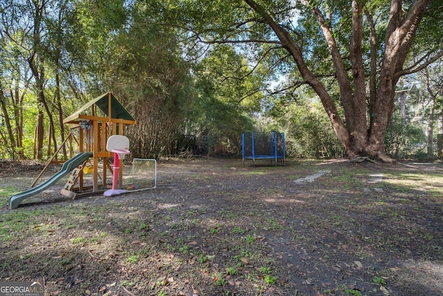 community play area with a trampoline