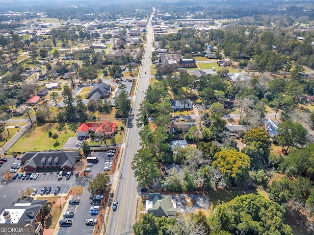 birds eye view of property with a residential view