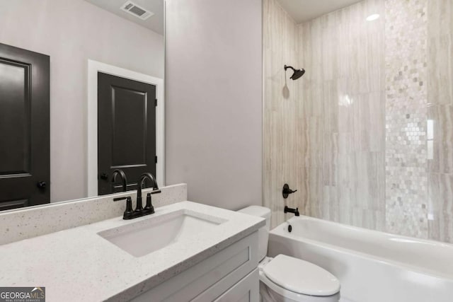 full bathroom featuring visible vents, shower / bathing tub combination, vanity, and toilet