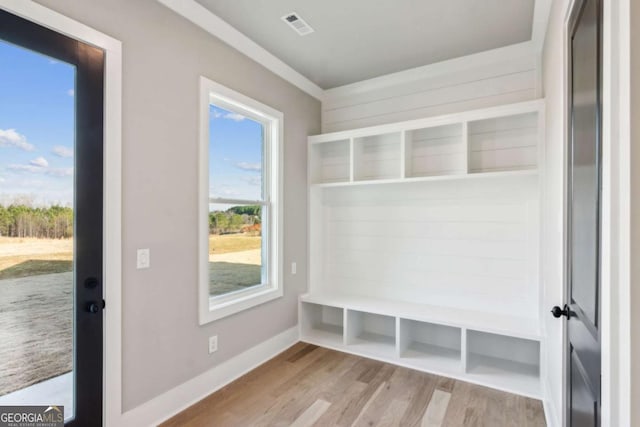 mudroom with light wood-style flooring, visible vents, and baseboards