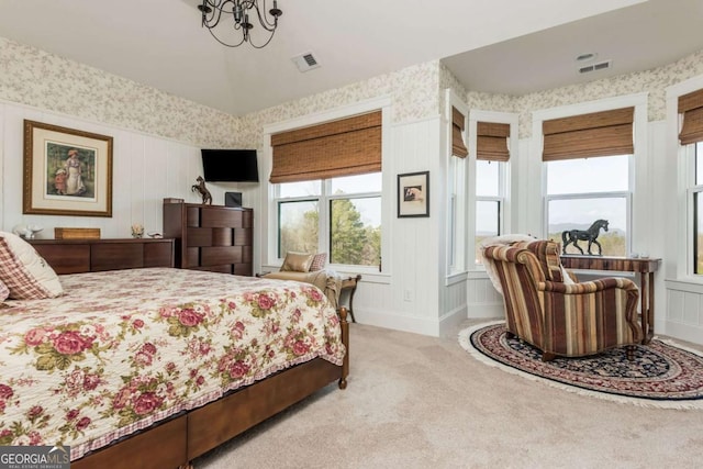 bedroom with light colored carpet, visible vents, baseboards, and wallpapered walls