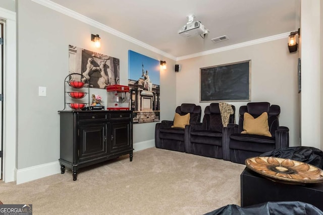 home theater room with baseboards, visible vents, crown molding, and light colored carpet