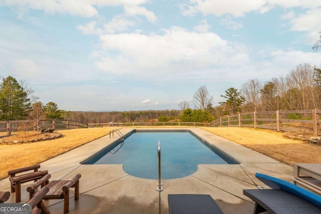 view of pool featuring a patio, a fenced backyard, and a fenced in pool