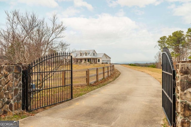 view of gate with fence