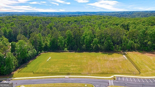 drone / aerial view featuring a view of trees