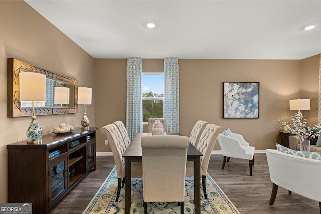 dining room with dark wood-type flooring, recessed lighting, and baseboards