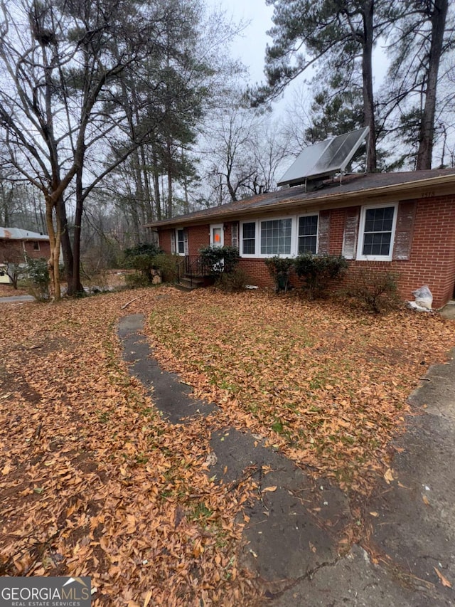 3518 Hamlin Cir, Atlanta, GA 30341 - view of front facade featuring brick siding and roof mounted solar panels