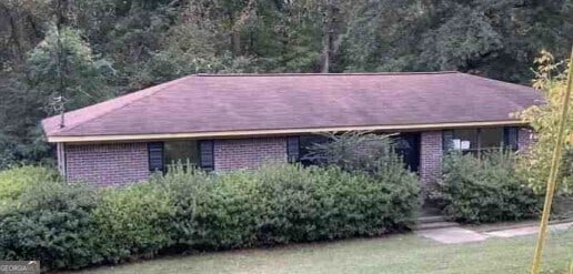 single story home with brick siding