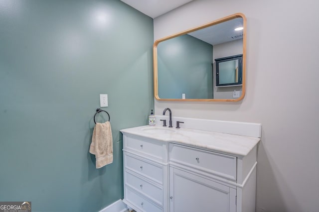 bathroom with visible vents and vanity