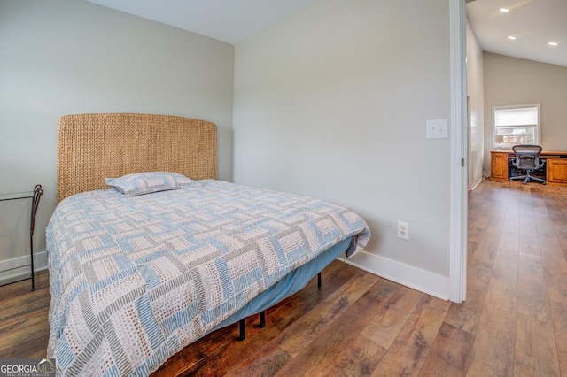 bedroom featuring lofted ceiling, recessed lighting, baseboards, and wood finished floors