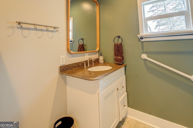 bathroom featuring vanity and baseboards