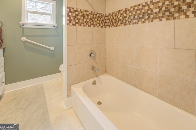 full bath featuring toilet, shower / bath combination, tile patterned flooring, and baseboards