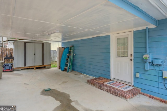 property entrance with a patio area and fence