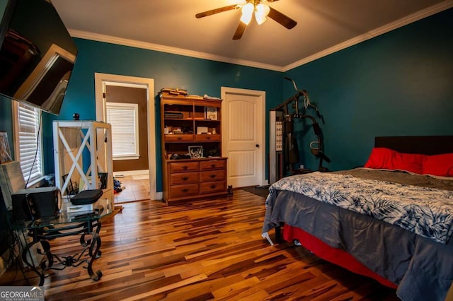 bedroom with crown molding, ceiling fan, and wood finished floors