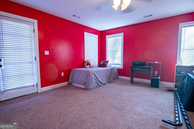 bedroom featuring carpet floors, visible vents, baseboards, and a ceiling fan