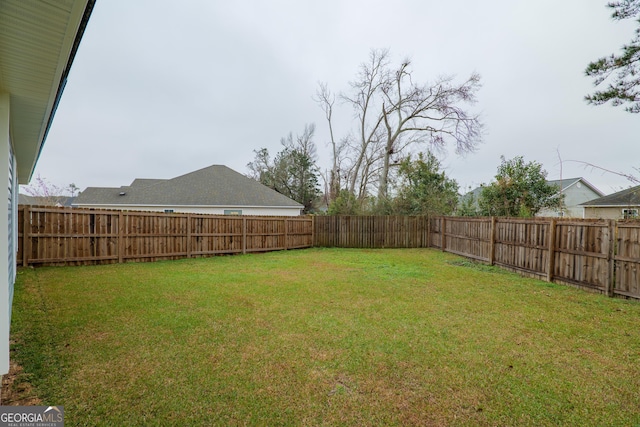 view of yard featuring a fenced backyard