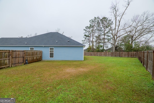 view of yard with a fenced backyard