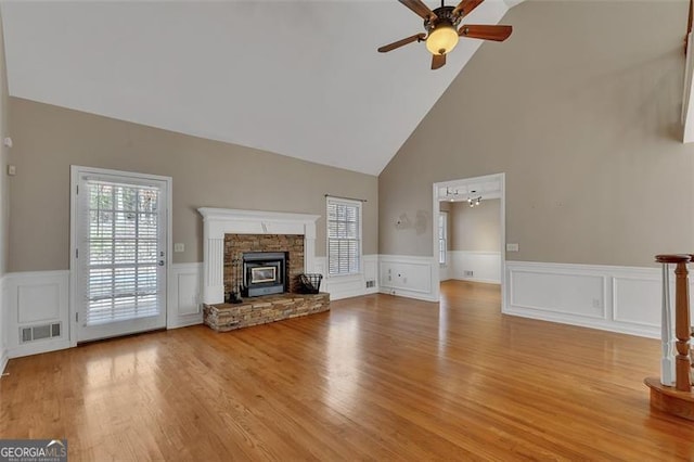 unfurnished living room with ceiling fan, light wood finished floors, visible vents, and a healthy amount of sunlight