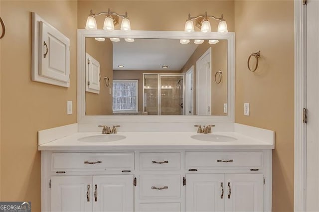 bathroom with a sink, a shower stall, and double vanity