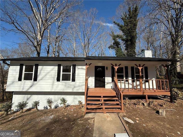 view of front of home with a chimney