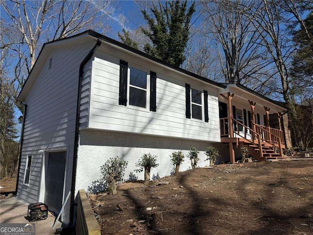 view of side of property featuring a porch