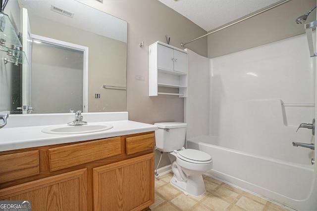 bathroom featuring visible vents, toilet,  shower combination, a textured ceiling, and vanity