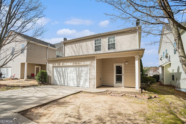 traditional home featuring a garage and concrete driveway