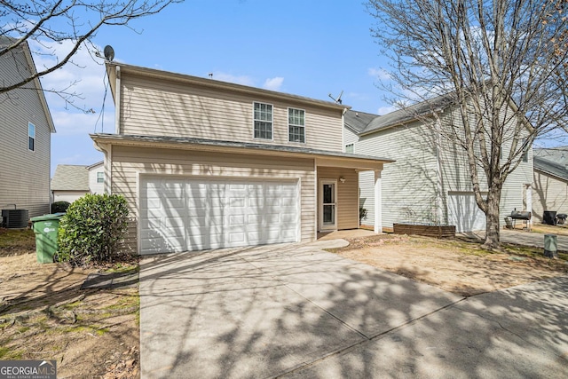 3272 Tiara Cir SW, Atlanta, GA 30311 - traditional-style home featuring central air condition unit, concrete driveway, and a garage