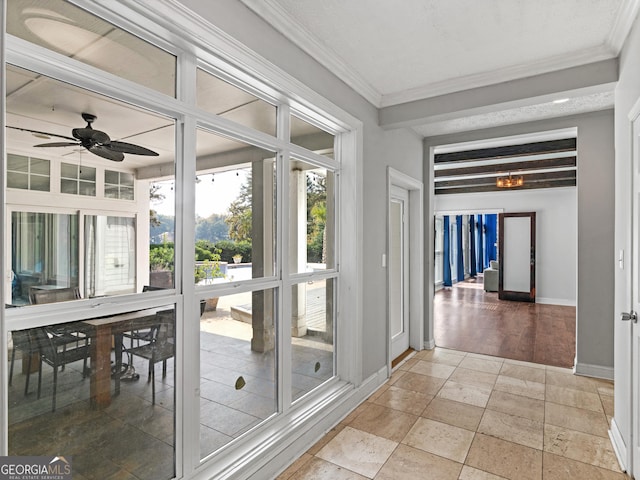 interior space with ceiling fan and beam ceiling