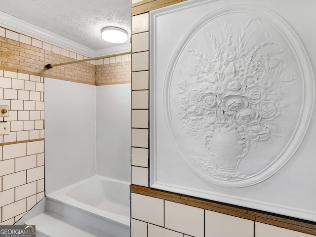 full bathroom featuring a textured ceiling, shower / bathtub combination, tile walls, and crown molding