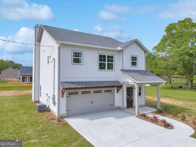 modern farmhouse with a garage, a front lawn, board and batten siding, and roof with shingles