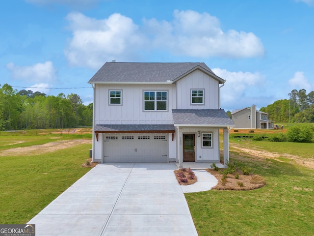 view of front of home featuring roof with shingles, concrete driveway, board and batten siding, a garage, and a front lawn