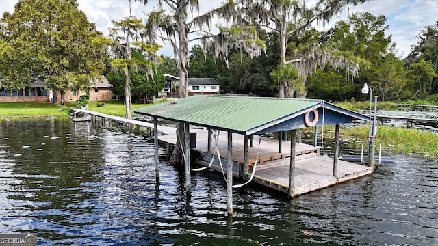 view of dock with a water view and boat lift