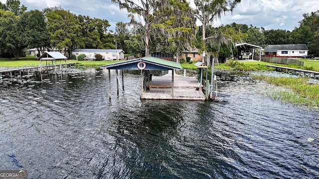 dock area featuring a water view and boat lift