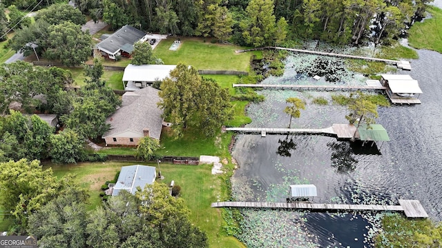 birds eye view of property featuring a water view