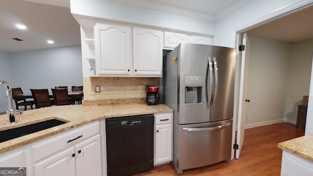 kitchen featuring black dishwasher, open shelves, white cabinets, a sink, and stainless steel fridge