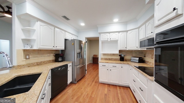 kitchen with open shelves, visible vents, white cabinets, a sink, and black appliances