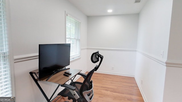 office space with light wood-type flooring, visible vents, baseboards, and recessed lighting