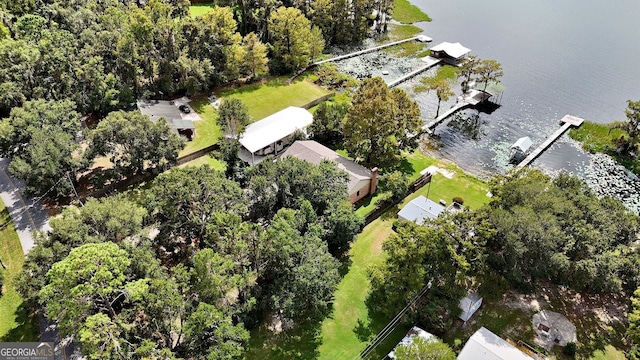 birds eye view of property with a water view