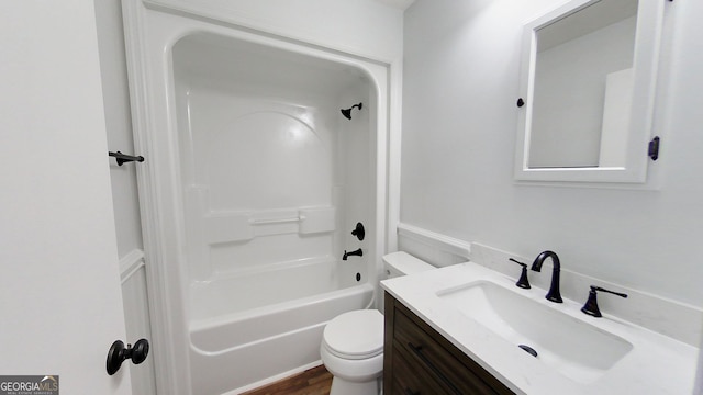 bathroom with shower / washtub combination, vanity, and toilet