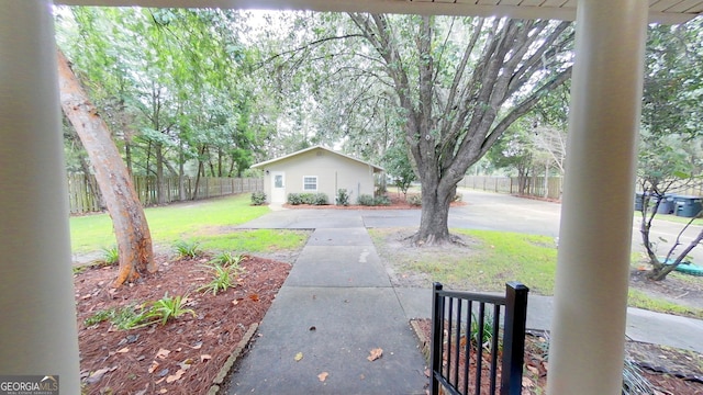 view of yard featuring fence and a patio