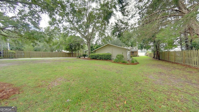 view of yard with a fenced backyard