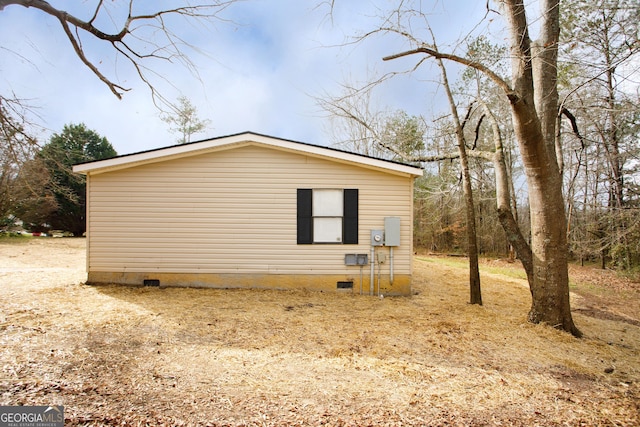 view of side of property with crawl space